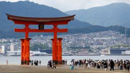 Tourists gather in front of the Itsukushima Shrine on Miyajima Island on September 9, 2023.