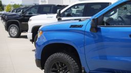Unsold 2023 Silverado pickup trucks sit in a long row at a Chevrolet dealership Sunday, June 18, 2023, in Englewood, Colo. 