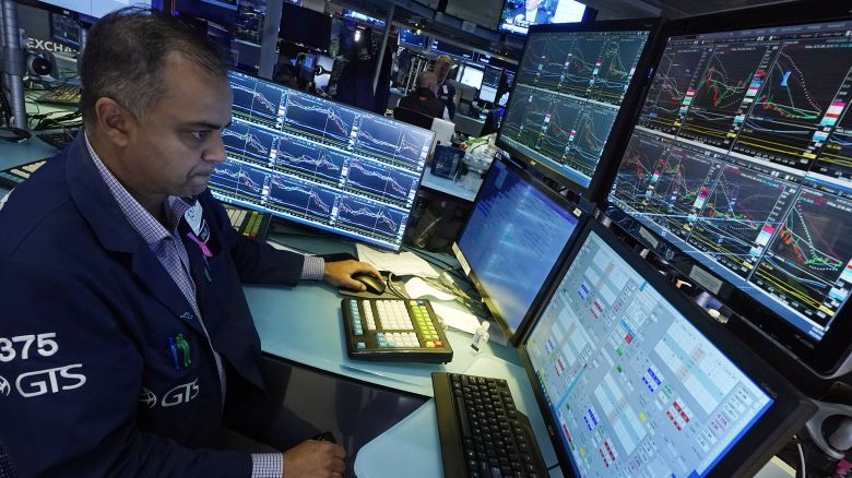 Specialist Dilip Patel works at his post on the floor of the New York Stock Exchange, Tuesday, Oct. 3, 2023. Wall Street is sinking sharply as it focuses on the downside of a surprisingly strong job market. 