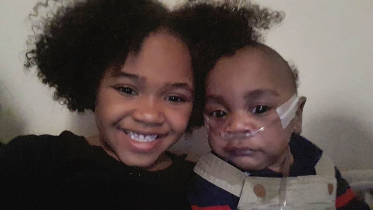 King Javier Black is seen alongside his sister, Kurrency Paul, upon his return from the hospital as a baby.