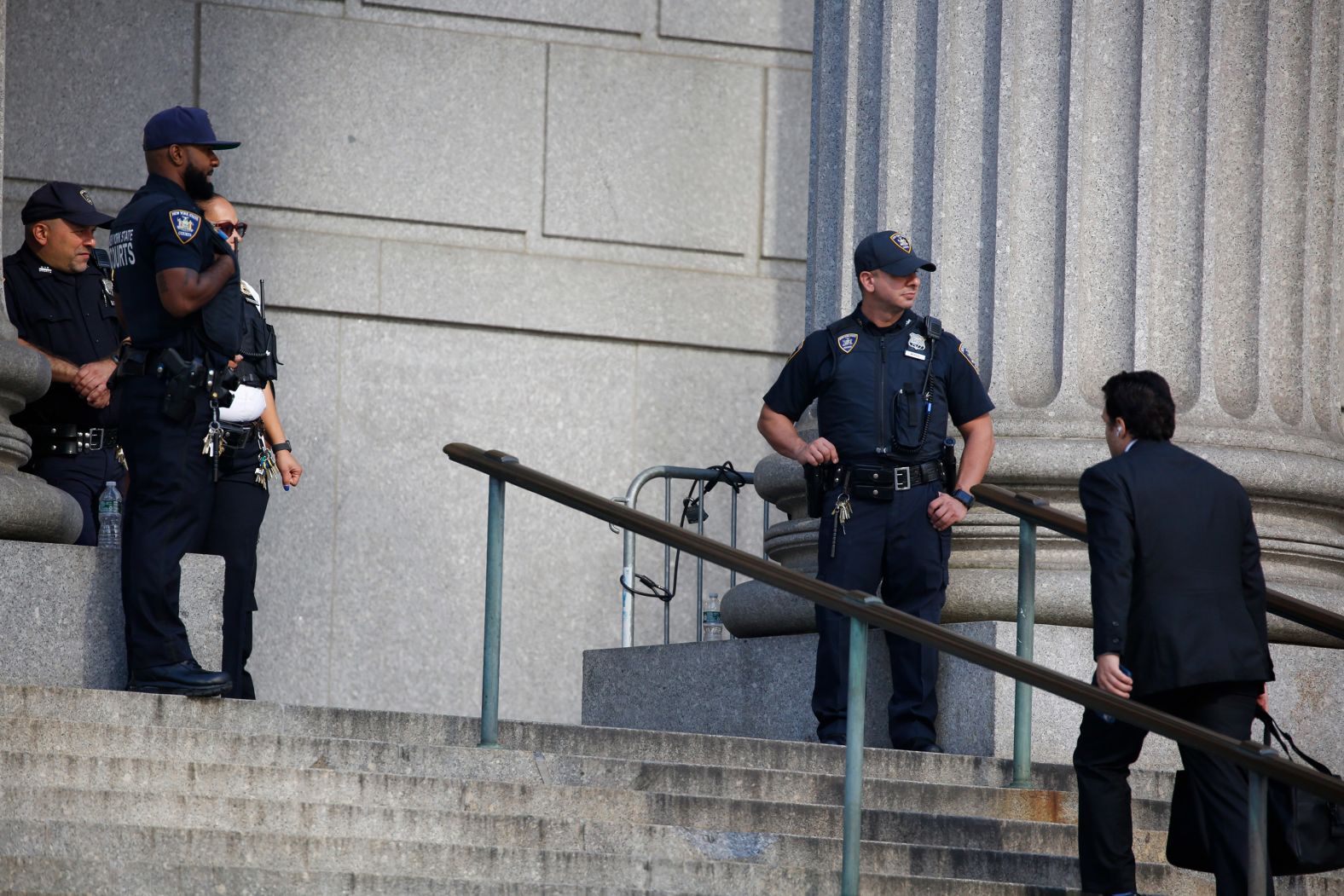 Police keep watch outside the court on October 3.
