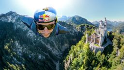 Renowned German B.A.S.E. jumper and skydiver, Max Manow, embarked on an exhilarating flight beside Neuschwanstein Castle in Germany. Using a specialised wingsuit system, he captured a unique view of the iconic Bavarian landmark. Starting from the Tegelberg cable car station in Schwangau, Manow made the most of favorable weather and launched his paraglider at 5,465 feet, covering a distance of about 2.5 kilometers. // Max Manow of Germany seen in front of the Neuschwanstein Castle in Schwangau, Bavaria, Germany on September 20, 2023 // Sebastian Marko / Red Bull Content Pool via AP Images  // For more content, pictures and videos like this please go to http://www.redbullcontentpool.com