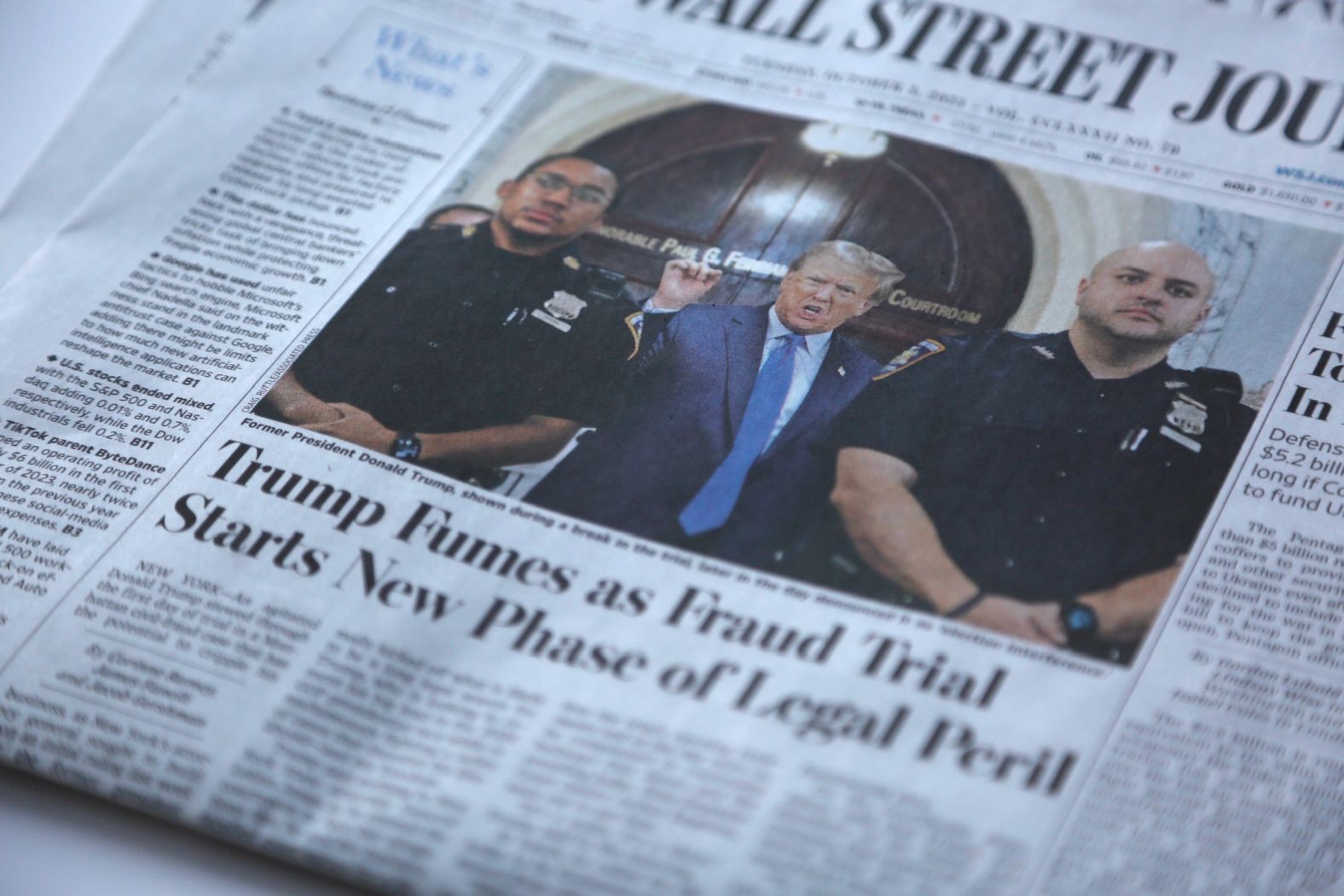 Coverage of the trial is seen on the front page of the Wall Street Journal on October 3.