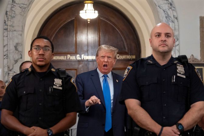 Trump speaks during a lunch break on October 2.<a href="index.php?page=&url=https%3A%2F%2Fwww.cnn.com%2Fpolitics%2Flive-news%2Ftrump-fraud-trial-new-york-10-02-23%2Fh_f90fa2e14924a00c133306c1868a0d53" target="_blank"> He criticized Engoron</a> and said the case against him was a "disgrace."