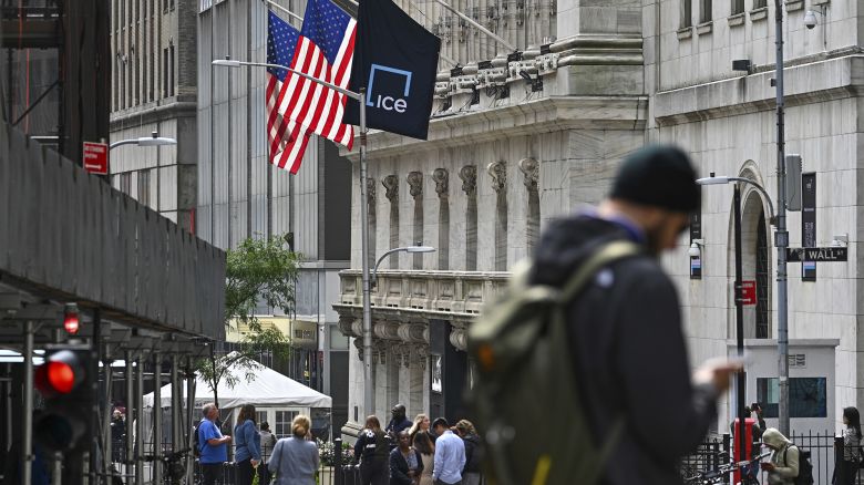 People walk past the New York Stock Exchange (NYSE) on Wall Street on September 27, 2023 in New York City.