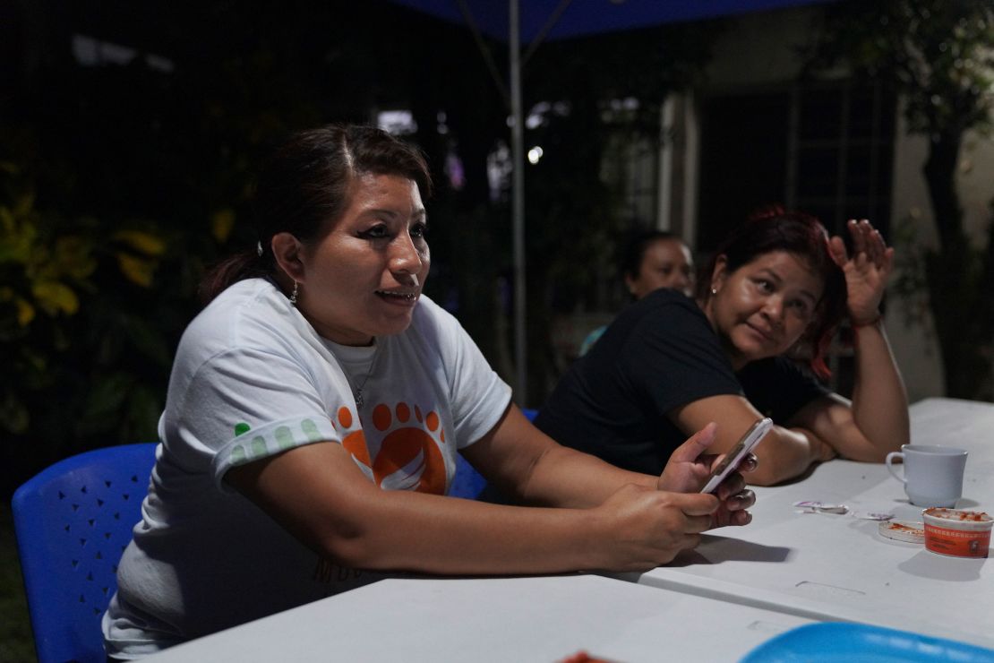 Teodora del Carmen Vásquez sits with friends and fellow members of her organization, Mujeres Libres (Free Women), on Friday, May 20, 2022, in San Salvador, El Salvador. Vásquez, who served 10 years for aggravated homicide after being arrested on suspicion of violating El Salvador's abortion law, started the group Mujeres Libres when she was released in 2018. Her group now fights to free other women and help them transition to new lives. (AP Photo/Jessie Wardarski)