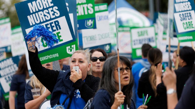 NextImg:Kaiser Permanente workers start to walk off the job. It's set to become the largest health care worker strike in US history | CNN Business