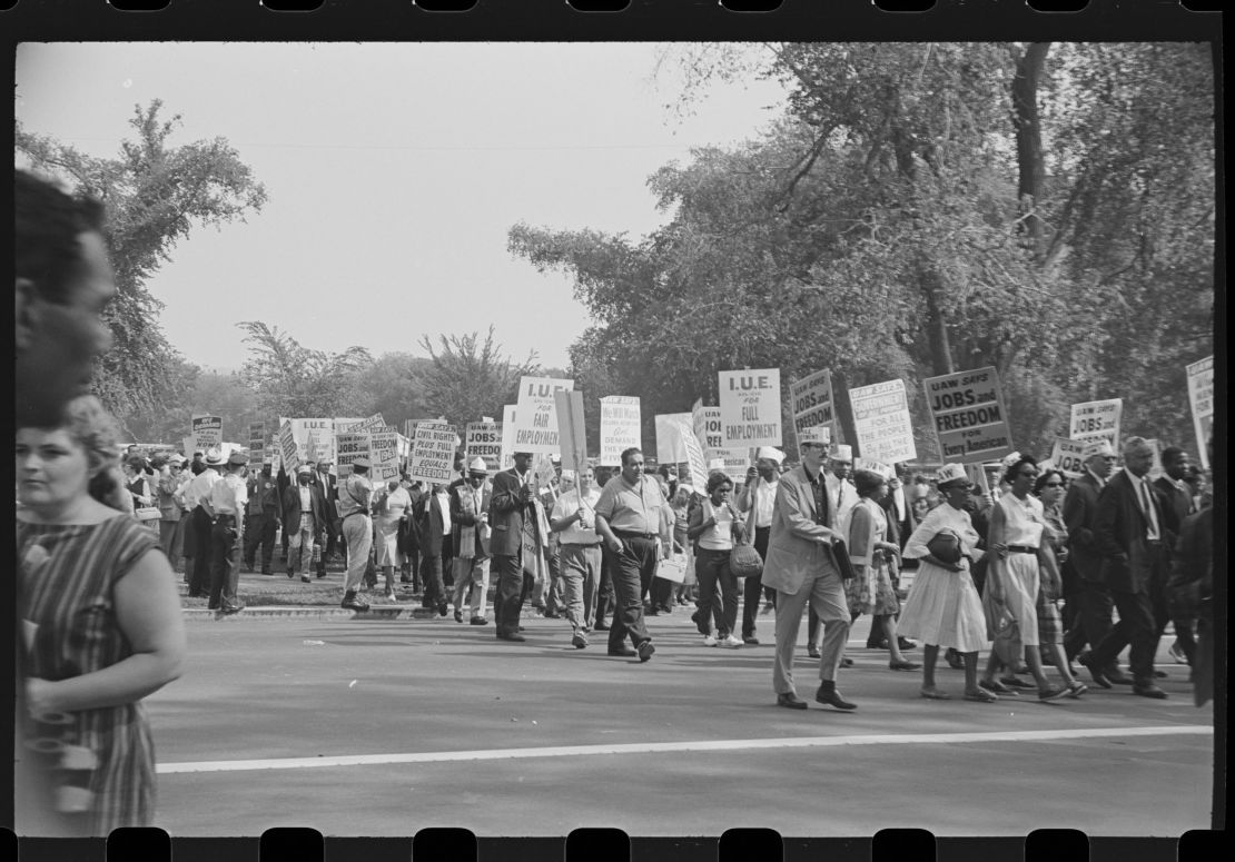 View of Civil Rights demonstrators, many with signs, during the March on Washington for Jobs and Freedom, Washington DC, August 28, 1963. Among the visible signs are ones that read 'UAW (United Auto Workers) Says Jobs and Freedom for Every American' and 'IUE (International Union of Electrical Workers) for Full Employment'. (Photo by Roosevelt H. Carter/Getty Images)