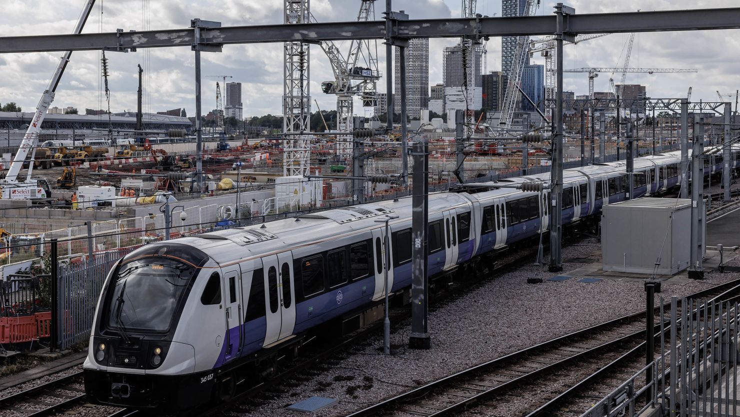 A train travels past construction on a HS2 site in London on October 3.