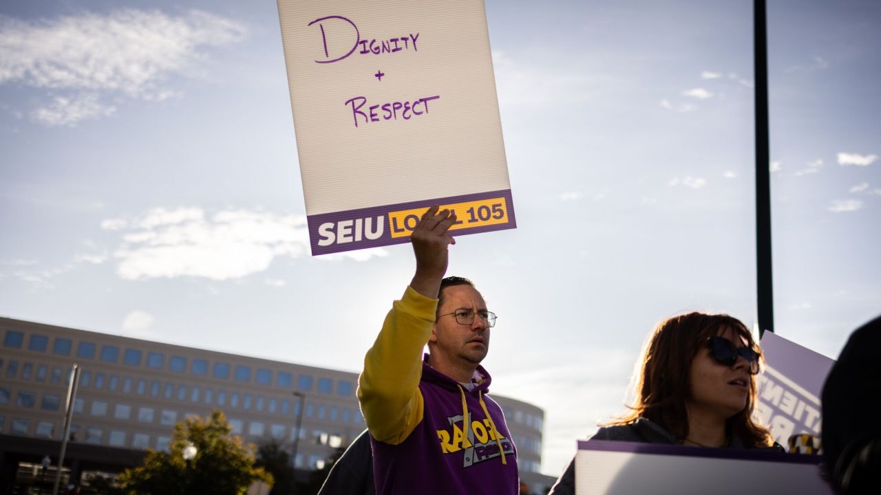 Kaiser Permanente healthcare workers and supporters on a picket line outside Kaiser Permanente medical offices in Denver.