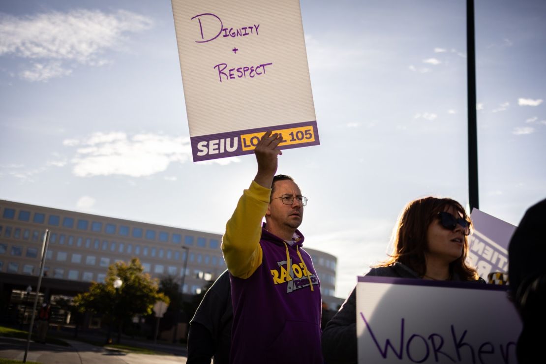 Kaiser Permanente healthcare workers and supporters on a picket line outside Kaiser Permanente medical offices in Denver.