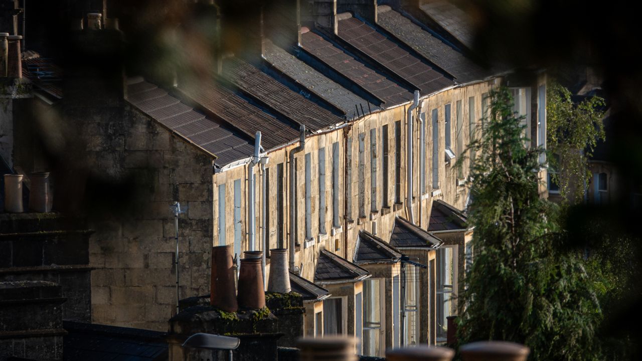 Early morning sun illuminates streets of residential terraced houses, on September 17, 2023 in Bath, England. Soaring interest rates and falling prices has meant the end of the UK's 13-year housing market boom potentially leading to a wider house price crash.