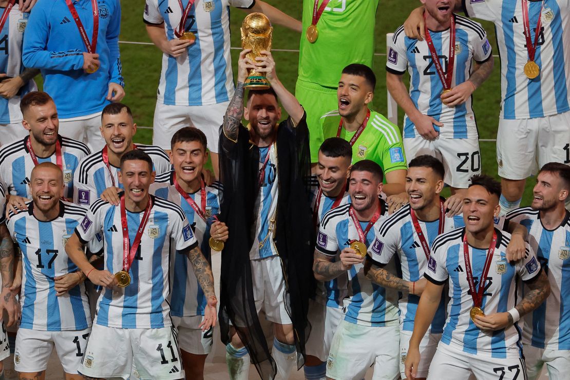 Argentina's forward #10 Lionel Messi lifts the World Cup trophy during the Qatar 2022 World Cup trophy ceremony after the football final match between Argentina and France at Lusail Stadium in Lusail, north of Doha on December 18, 2022. - Argentina won in the penalty shoot-out. (Photo by Odd ANDERSEN / AFP) (Photo by ODD ANDERSEN/AFP via Getty Images)