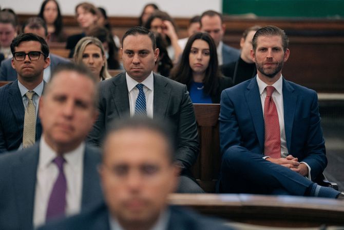 Eric Trump, right, attends the proceedings on October 4.