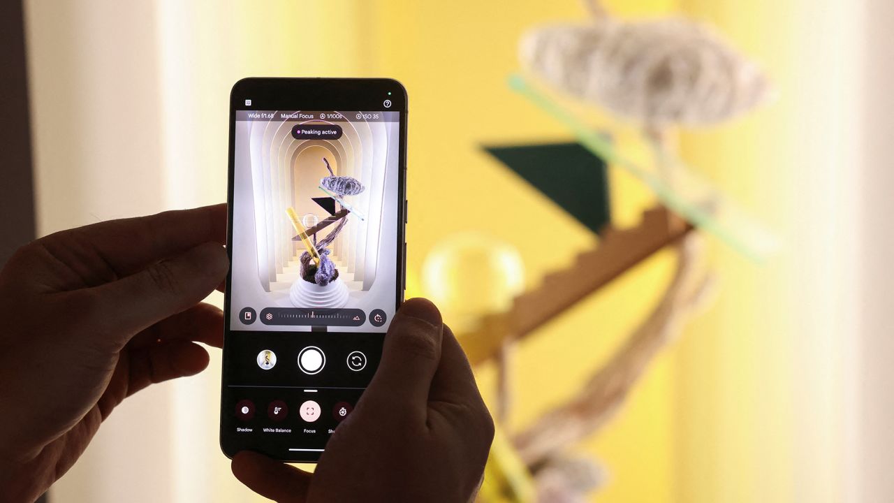 Google unveils Pixel 8 built for 'the generative AI era' | CNN Business 2 A Google employee demonstrates manual focus features of the new Google Pixel 8 Pro Phone in New York City, U.S., October 4, 2023.