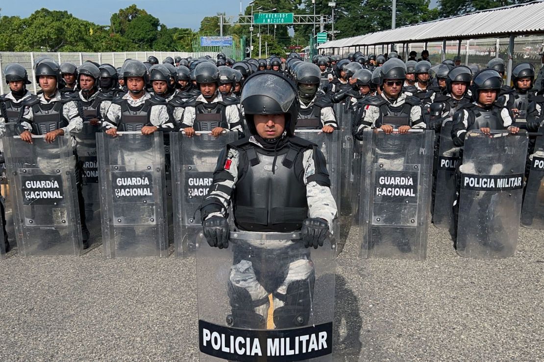 Members of the Mexican National Guard stand on the border between Mexico and Guatemala to prevent the crossing of migrant caravans on October 21, 2022.