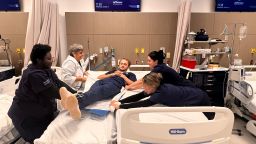 Thomas Jefferson University College of Nursing students practice transferring a patient.