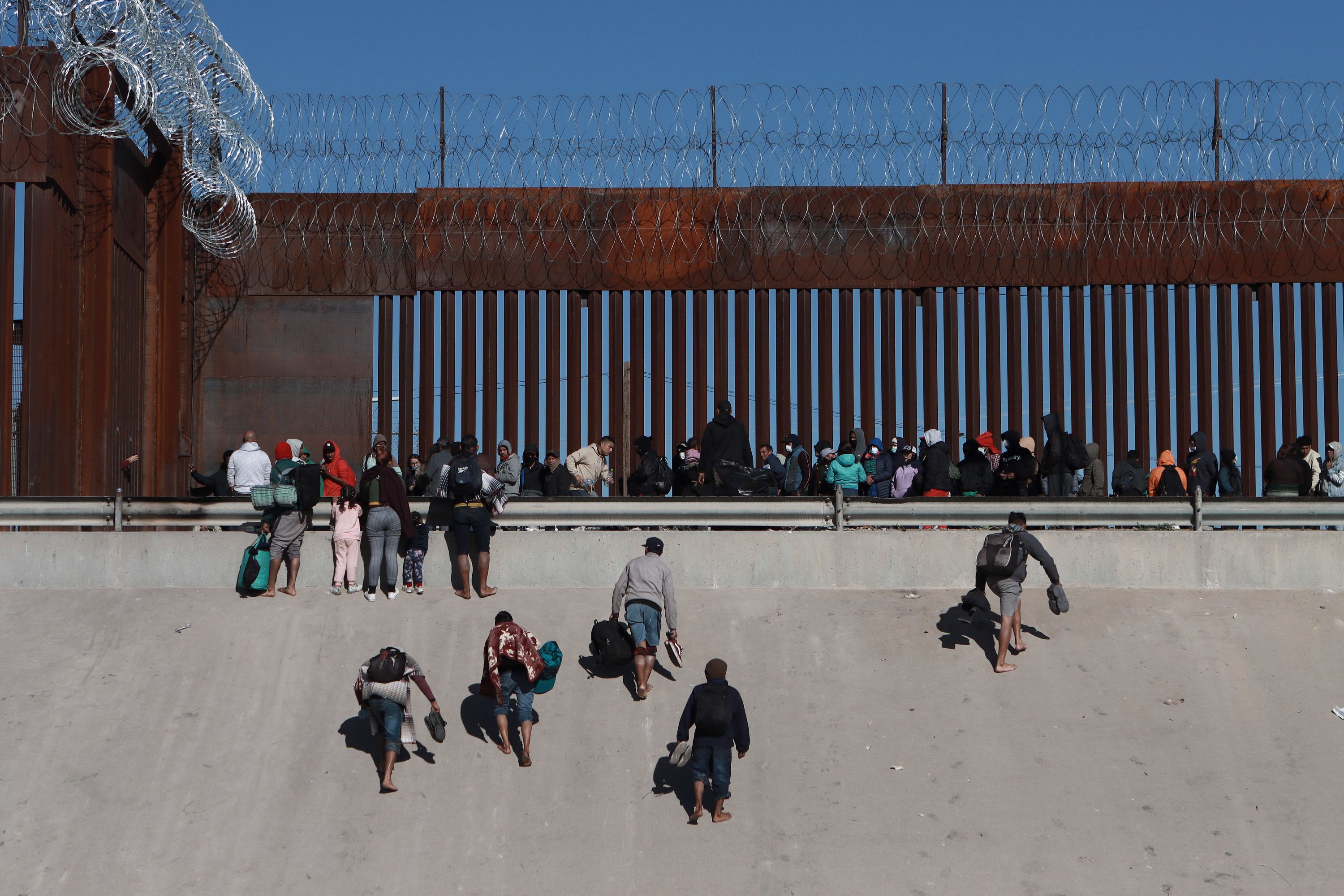 Biden says he had to use Trump-era funds for the border wall. Asked if  barriers work, he says 'No