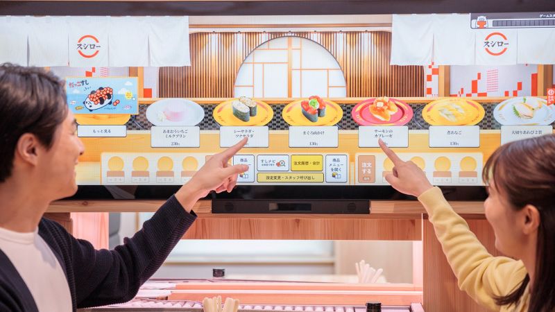 Sushi restaurant with outlet conveyor belt