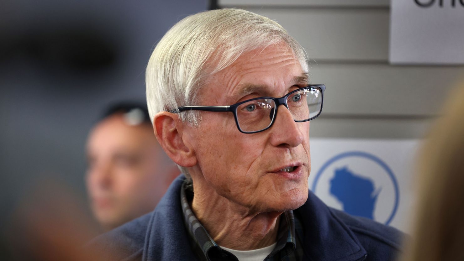 Wisconsin Gov. Tony Evers speaks to the press during a canvas launch event on November 7, 2022, in Milwaukee.