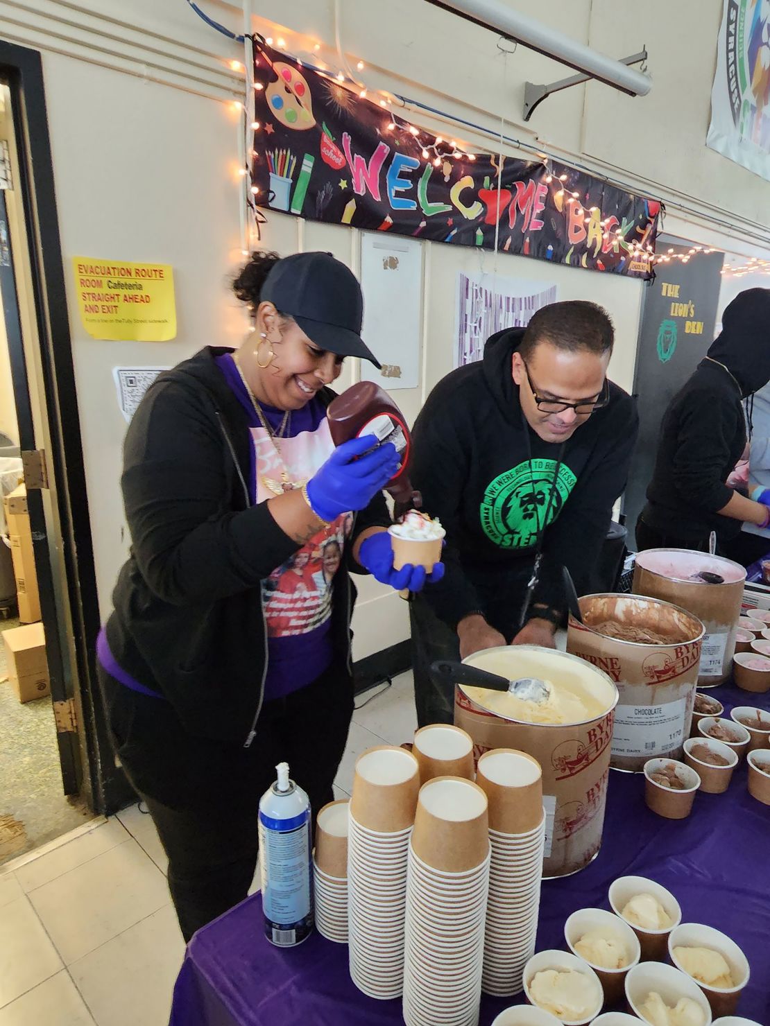 Brenlee Ortiz, left, prepares ice cream for students at her late daughter's school on 