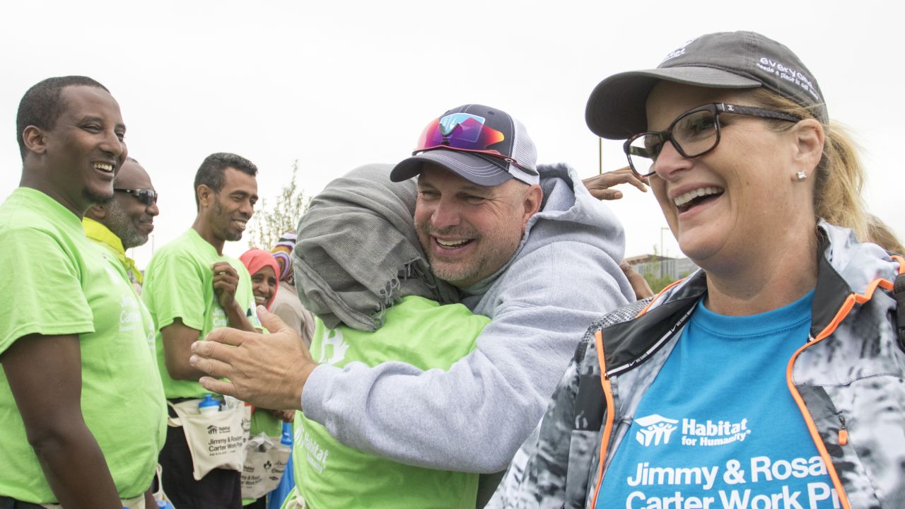 Garth Brooks and Trisha Yearwood meet volunteers and future homeowners at the  Habitat for Humanity International's Jimmy & Rosalynn Carter Work Project in Edmonton, Canada in 2017.