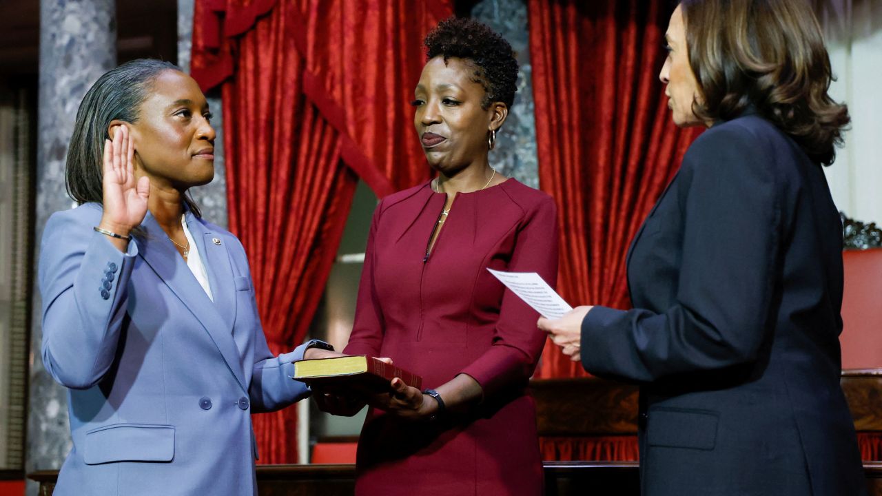 US Vice President Kamala Harris swears in Laphonza Butler to the Senate as her wife, Neneki Lee, holds the Bible on October 3, 2023. 