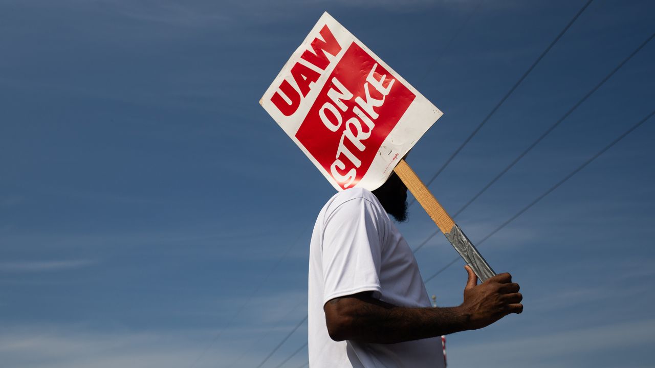 A "UAW On Strike" sign held on a picket line outside the General Motors Ypsilanti Processing Center in Ypsilanti, Michigan, on Friday, September 22.