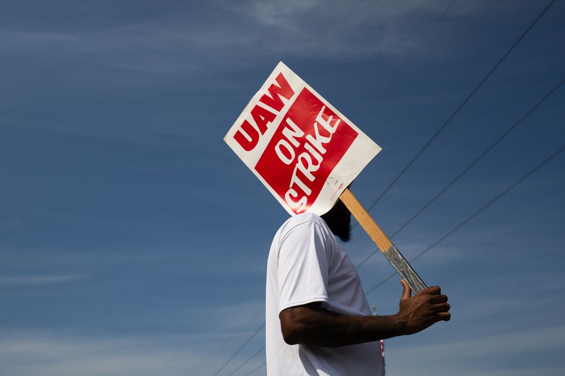 A "UAW On Strike" sign held on a picket line outside the General Motors Ypsilanti Processing Center in Ypsilanti, Michigan, on Friday, September 22.
