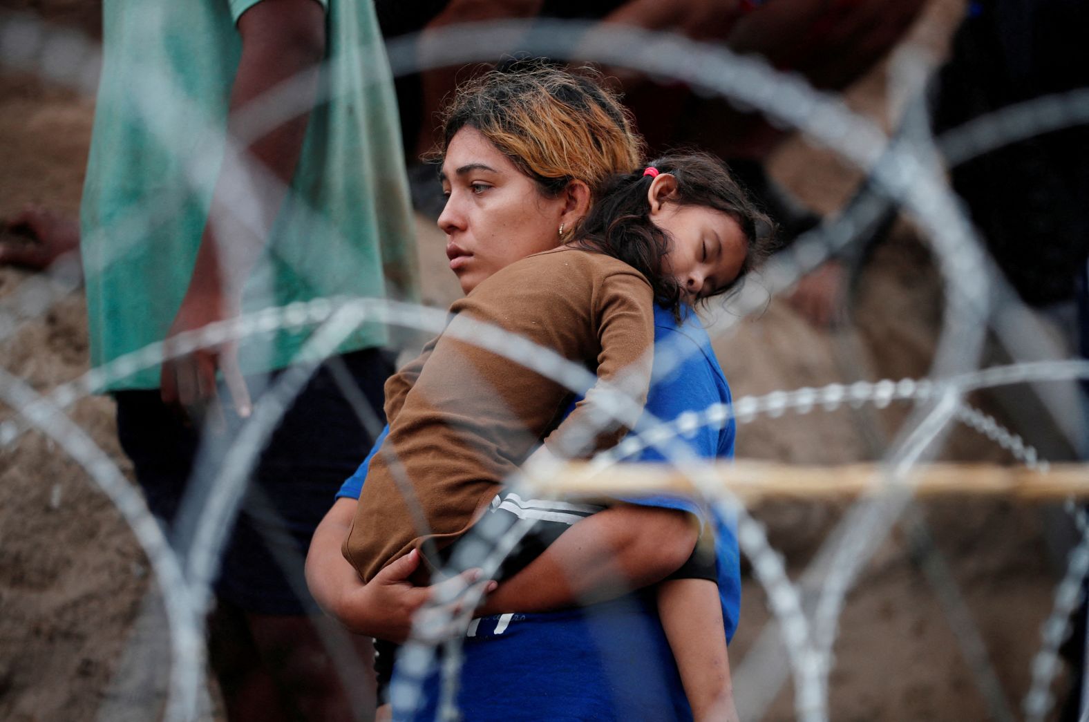 A girl sleeps in her mother's arms after they walked through the Rio Grande to seek asylum in the United States on Saturday, September 30. <a href="https://www.cnn.com/2023/10/02/politics/border-crossings-september/index.html" target="_blank">The US Border Patrol apprehended more than 200,000 migrants crossing the US-Mexico border unlawfully in September</a>, according to a Homeland Security official. It's the highest total this year.