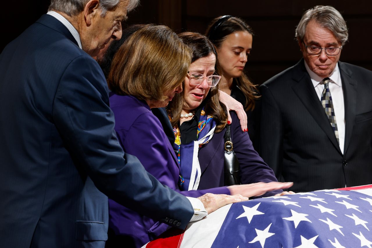 Former House Speaker Nancy Pelosi, second from left, comforts her eldest daughter, Nancy Prowda, as they pay their respects to the late US Sen. Dianne Feinstein on Wednesday, October 4. <a href="https://www.cnn.com/2023/10/05/politics/senator-dianne-feinstein-funeral/index.html" target="_blank">Feinstein was lying in state</a> in San Francisco. <a href="https://www.cnn.com/2023/09/29/politics/gallery/dianne-feinstein/index.html" target="_blank">Feinstein</a>, who died last week at the age of 90, was the first female mayor of San Francisco, and she later served in the US Senate for more than 30 years. She was the longest-serving female senator in US history.