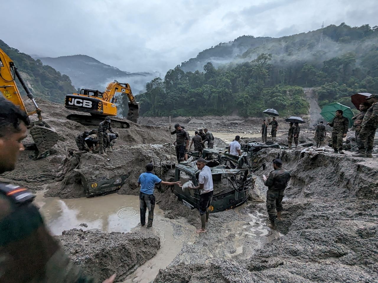 Members of the Indian Army try to recover trucks that were buried at a flood-affected area in the state of Sikkim. Heavy rain caused a glacial lake to burst, <a href="https://www.cnn.com/2023/10/05/india/india-sikkim-floods-search-damage-climate-intl-hnk/index.html" target="_blank">leading to flash floods</a> that killed at least 14 people and washed away roads and bridges, according to the state government. This undated photo was released by the Indian Army on Thursday, October 5.