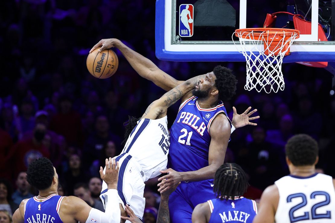 PHILADELPHIA, PENNSYLVANIA - FEBRUARY 23: Joel Embiid #21 of the Philadelphia 76ers blocks Ja Morant #12 of the Memphis Grizzlies during the fourth quarter at Wells Fargo Center on February 23, 2023 in Philadelphia, Pennsylvania. NOTE TO USER: User expressly acknowledges and agrees that, by downloading and or using this photograph, User is consenting to the terms and conditions of the Getty Images License Agreement. (Photo by Tim Nwachukwu/Getty Images)
