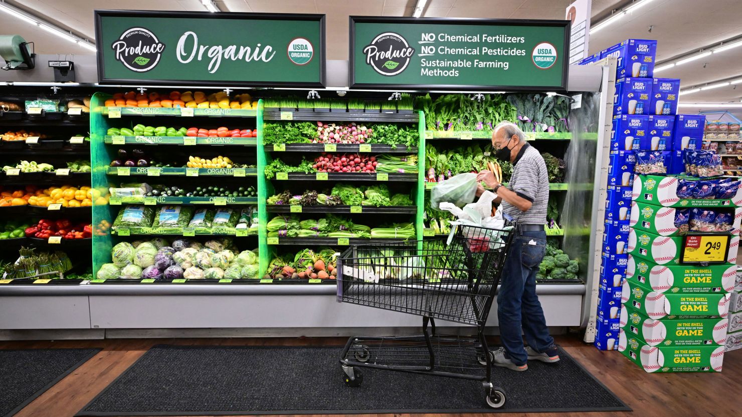 A shopper looks at organic produce at a supermarket in Montebello, California, on August 23, 2022.