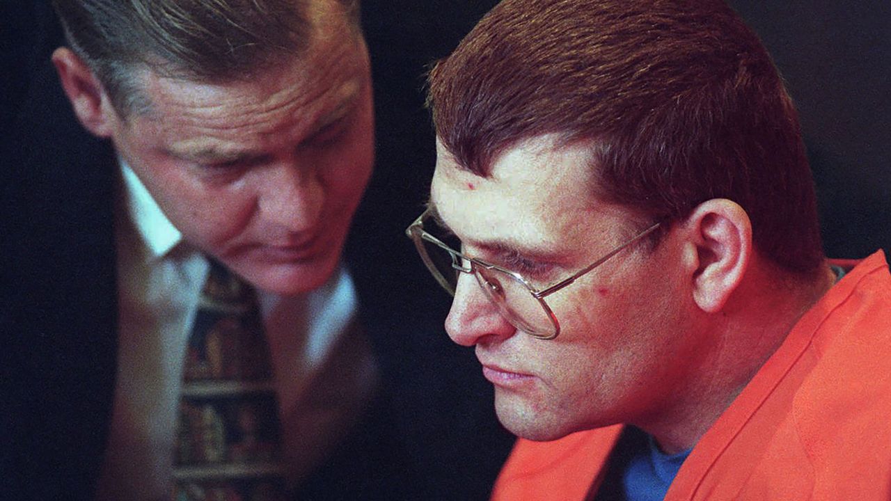 Keith Hunter Jesperson, right, listens to his attorney moments before pleading guilty to murder charges in October 1995.