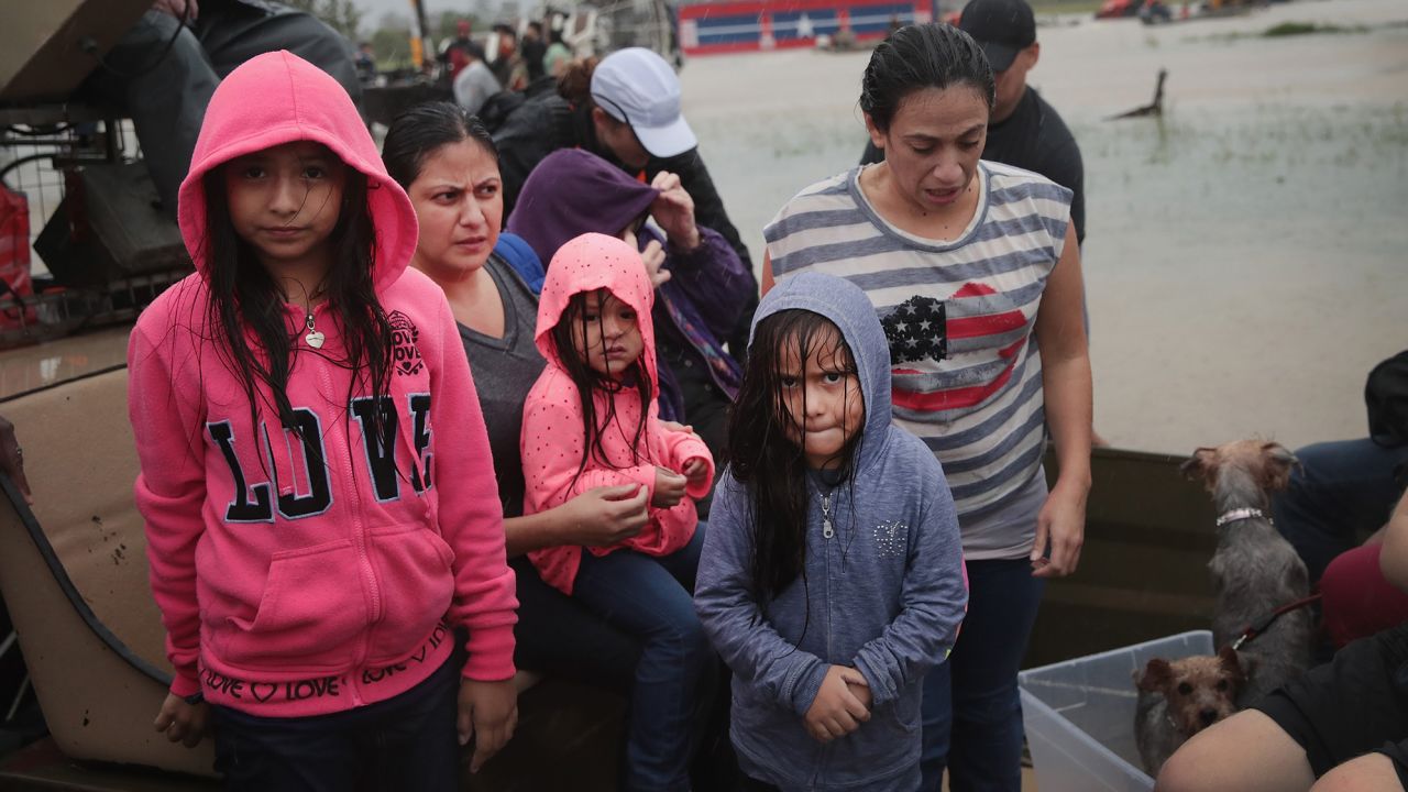 People rescued from a flooded neighborhood after it was inundated with rain water, remnants of Hurricane Harvey, on August 28, 2017 in Houston, Texas.