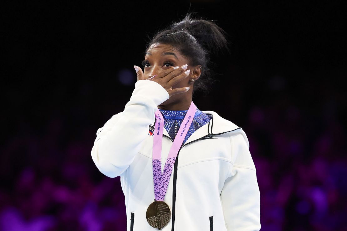 United States' Simone Biles cries on the podium after wining the gold medal during the women's all-round final at the Artistic Gymnastics World Championships in Antwerp, Belgium, Friday, Oct. 6, 2023. (AP Photo/Geert vanden Wijngaert)
