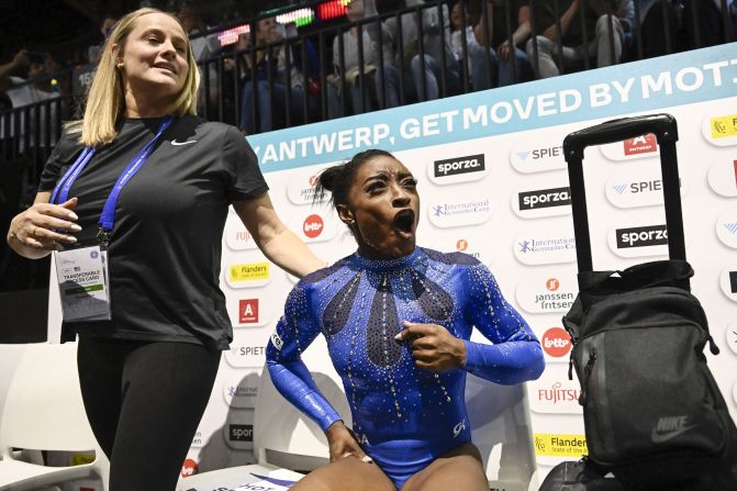 Biles celebrates after winning the individual all-around at the World Artistic Gymnastics Championships in October 2023. <a href="index.php?page=&url=https%3A%2F%2Fwww.cnn.com%2F2023%2F10%2F06%2Fsport%2Fsimone-biles-history-world-championships-spt-intl%2Findex.html" target="_blank">By winning gold</a>, she became the most decorated female or male gymnast ever, surpassing Belarusian Vitaly Scherbo's record of 33 overall medals across both the Olympics and the world championships.