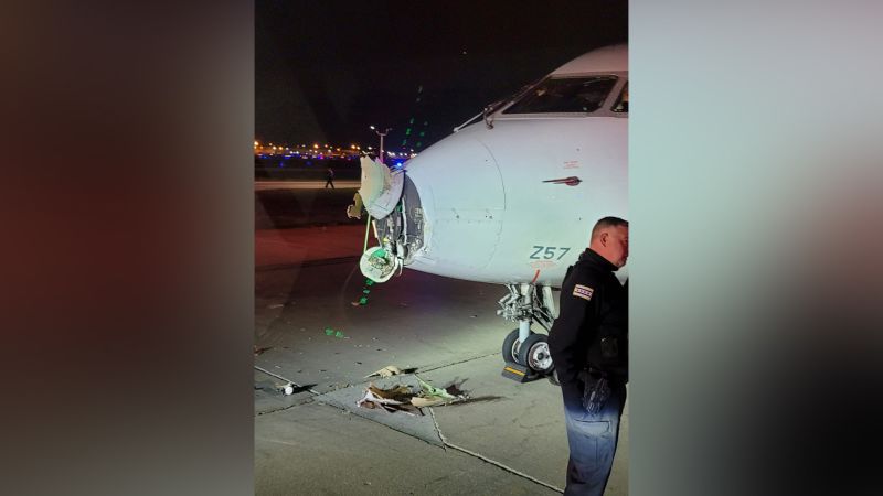 Taxiing airplane and shuttle bus collide at Chicago s O Hare