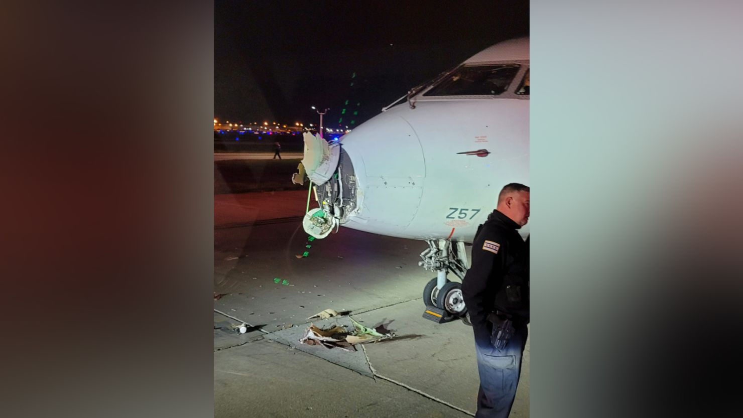 Damage to the nose of an aircraft is seen Friday night after the plane collided with a shuttle bus as the craft was taxiing at Chicago O'Hare International Airport.