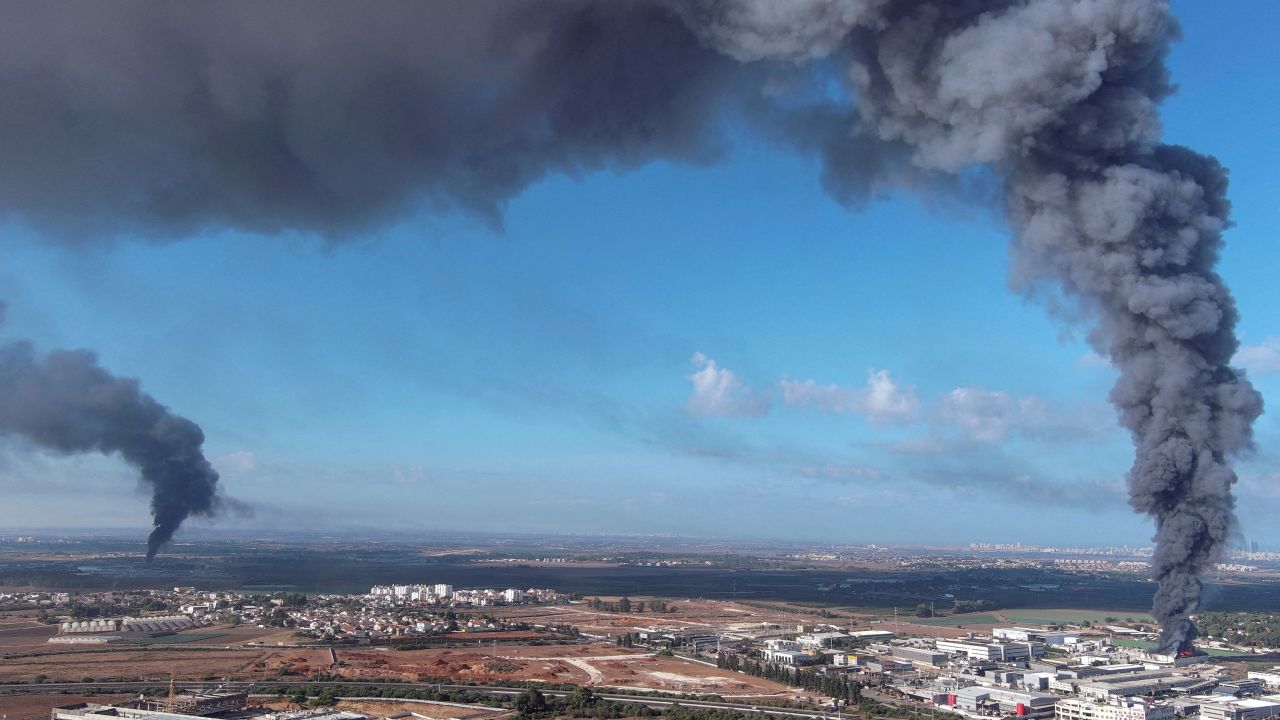 Smoke is seen in the area of Rehovot, a city in central Israel, as rockets are launched from the Gaza Strip.