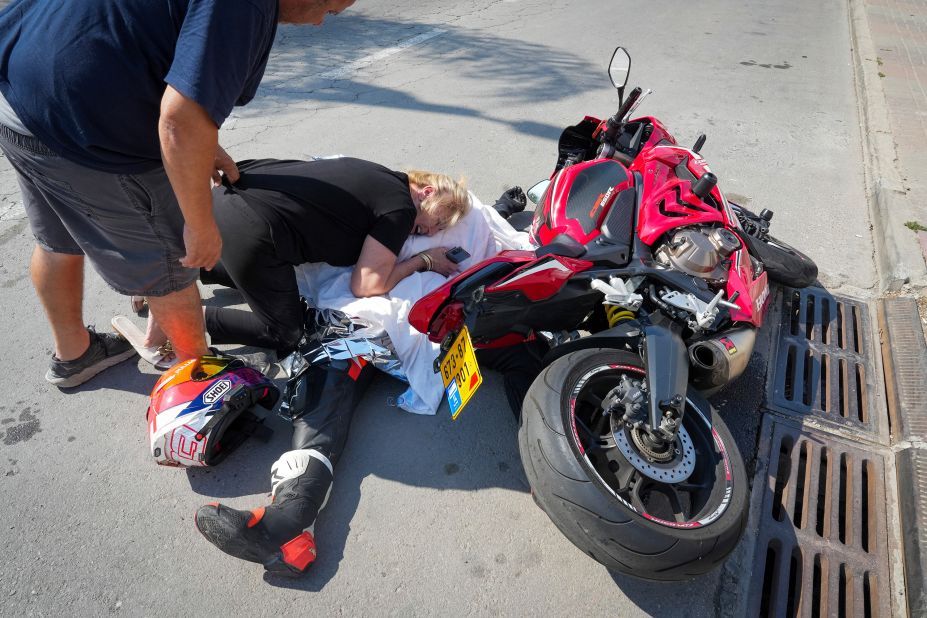 An Israeli woman react over the body of her relative who was killed in the southern Israeli city of Sderot on Saturday.