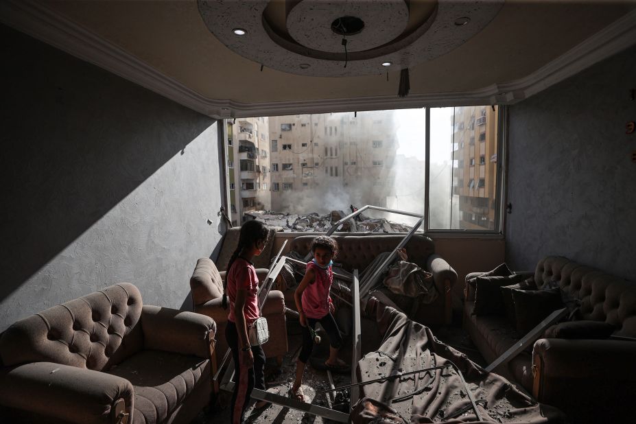 Children are seen in a damaged house in Gaza after Israeli airstrikes on Saturday.