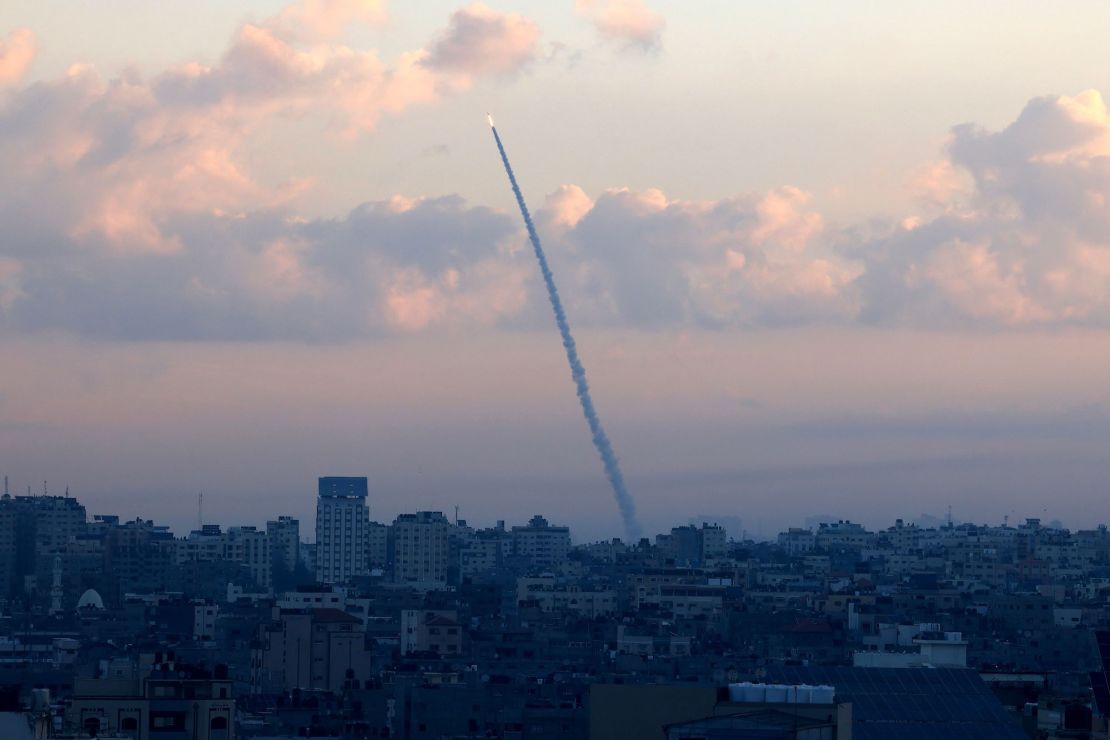 TOPSHOT - Rockets are fired from Gaza City towards Israel on October 7, 2023. Dozens of rockets were fired from the blockaded Gaza Strip towards Israel on October 7, 2023, an AFP journalist in the Palestinian territory said, as sirens warning of incoming fire blared in Israel. (Photo by MAHMUD HAMS / AFP) (Photo by MAHMUD HAMS/AFP via Getty Images)