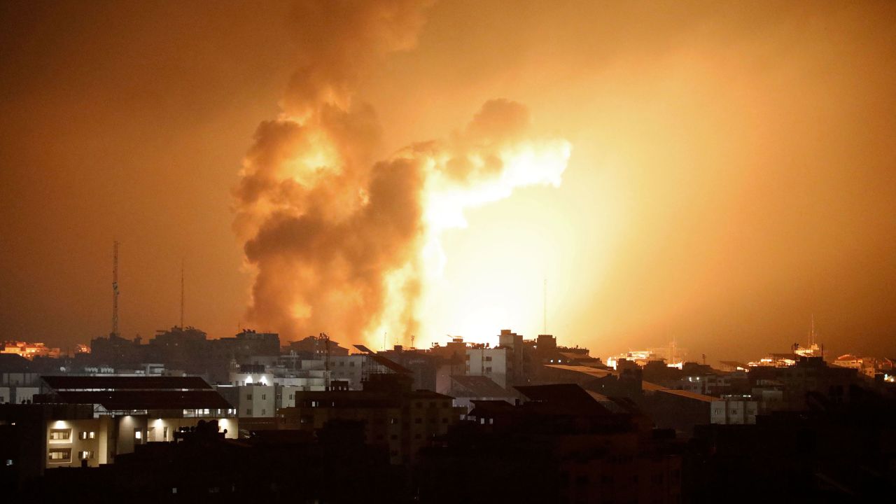 Fire and smoke rises above buildings during an Israeli air strike in Gaza City on October 8, 2023. At least 200 Israelis died in a surprise large-scale attack by the Palestinian militant group Hamas on October 7, 2023, the army said, as Prime Minister Benjamin Netanyahu vowed to reduce the group's Gaza hideouts to "rubble". (Photo by EYAD BABA / AFP) (Photo by EYAD BABA/AFP via Getty Images)