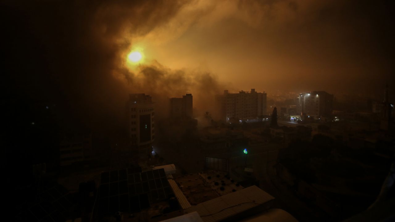 Flames rise in Burc Vatan shopping mall in Gaza following bombing of Israeli forces with warplanes. 