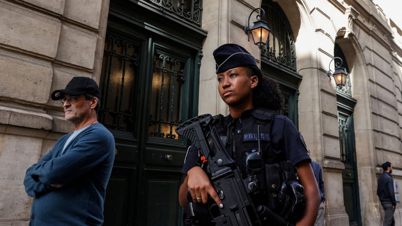 A French police officer carrying a G36 assault rifle patrols outside the Tournelles Synagogue, after increased security measures were put in place at Jewish temples and schools, in central Paris, on Sunday.
