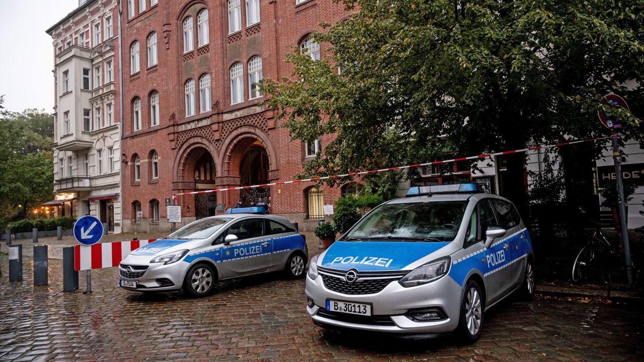 Police vehicles stand in front of the synagogue on Ryckestrasse in Berlin, Germany. 