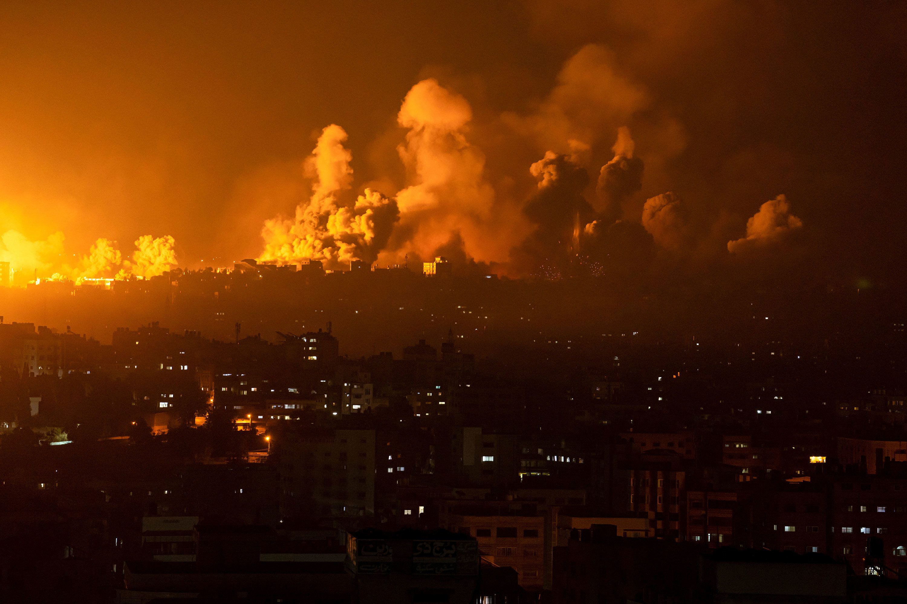 Fire and smoke rise from Gaza City following an Israeli airstrike on October 8.