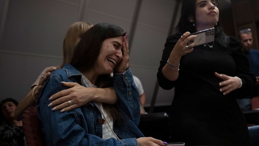A relative of an Israeli missing since a surprise attack by Hamas militants near the Gaza border, is overcome by emotion during a press conference in Ramat Gan, Israel, Sunday, Oct. 8, 2023. (AP Photo/Maya Alleruzzo)